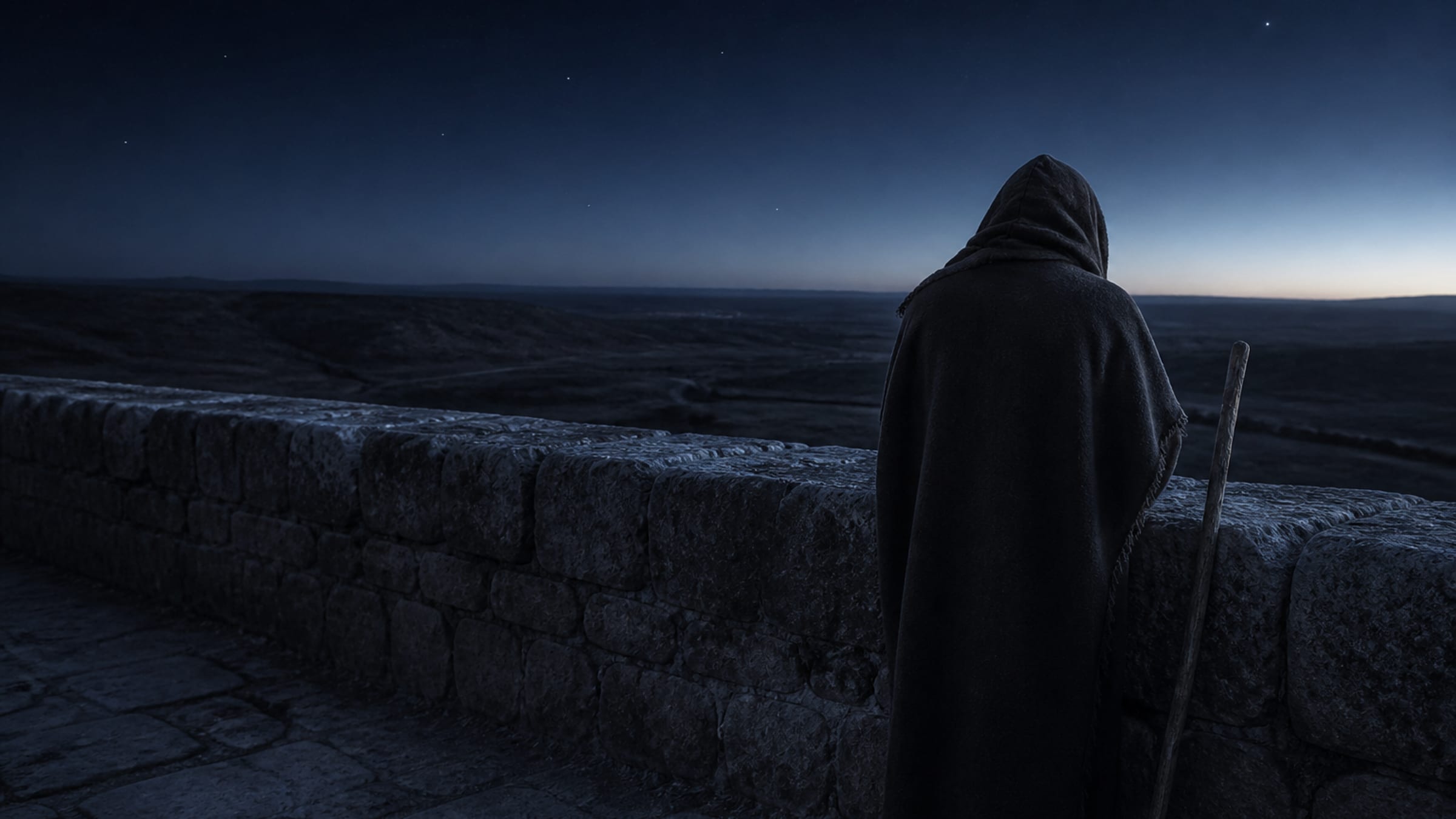 A cloaked watchman stands at the parapet of an ancient stone wall before dawn, looking out over a dark plain as the horizon faintly pales.